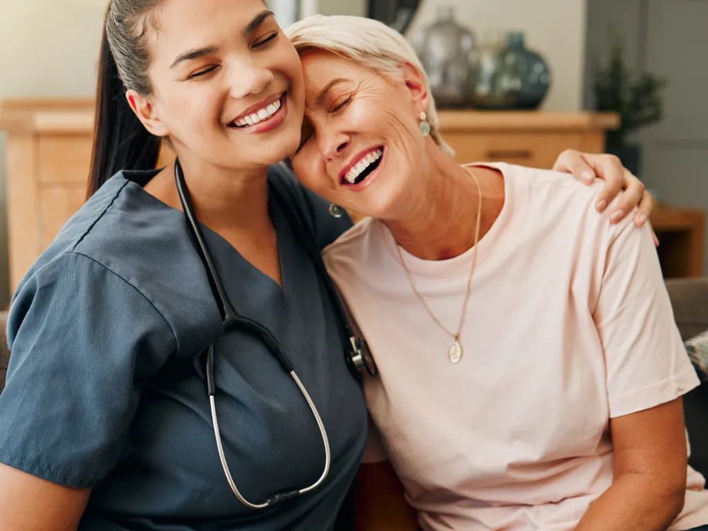 Home nursing in Dubai: a DHA-licensed nurse comforting an elderly patient at home